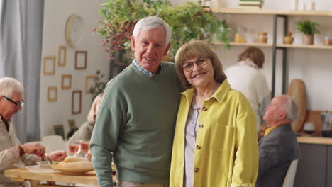 Portrait-of-Happy-Elderly-Couple-at-Home-Dinner-Party